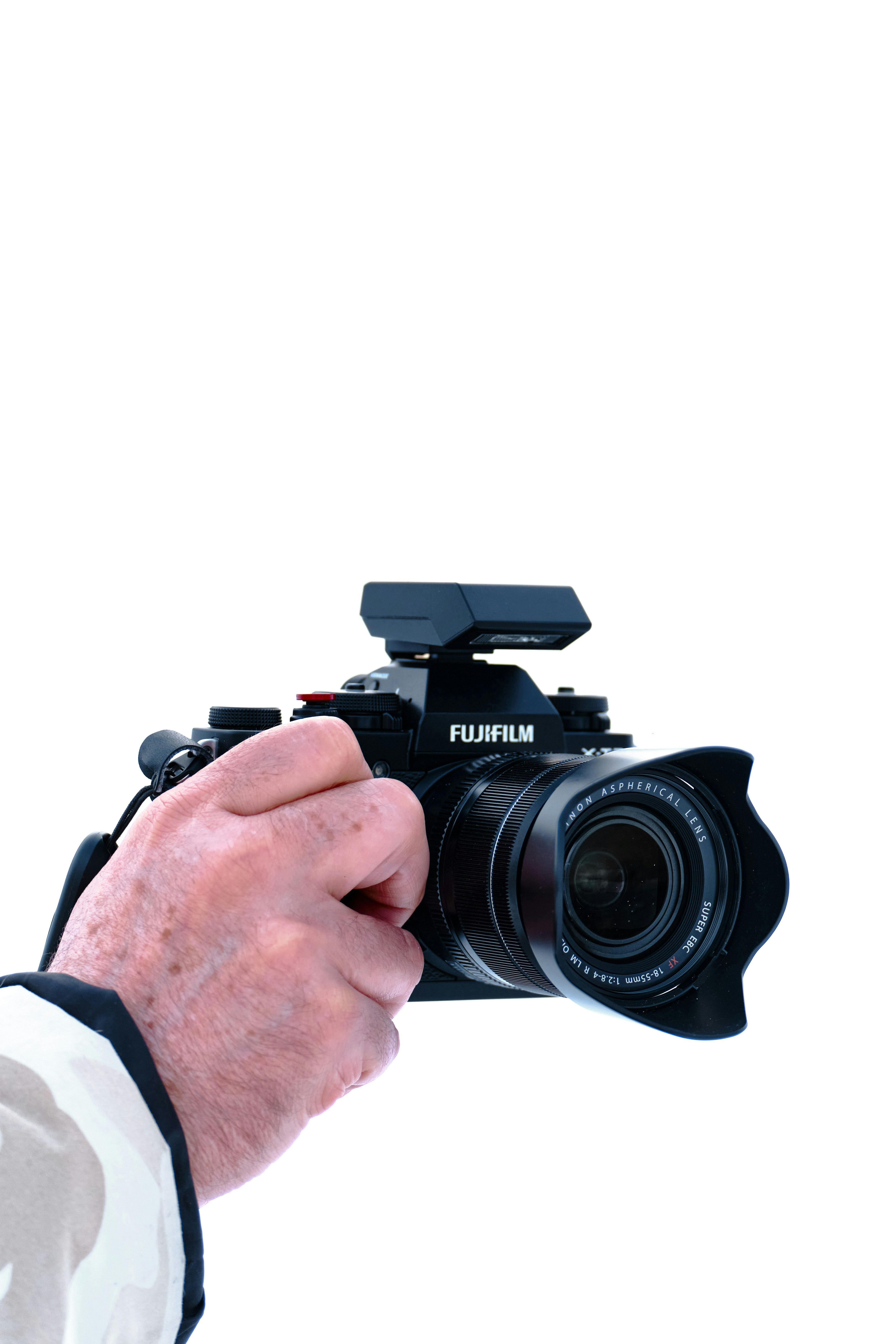 person holding black nikon dslr camera